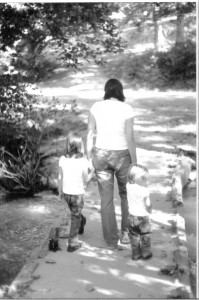 Walking along life's path My sister-in-law walking with her two daughters. Her daughters cling to her hands and trust she is leading them down the correct path.